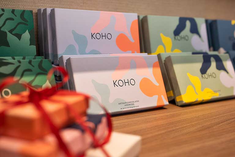 Shelf of KOHO chocolates in a retail store.