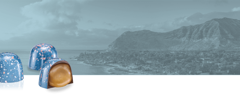 KOHO BonBons over a scenic photo of a beach with mountains in the background